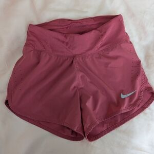 Pink Nike dri fit lined running shorts